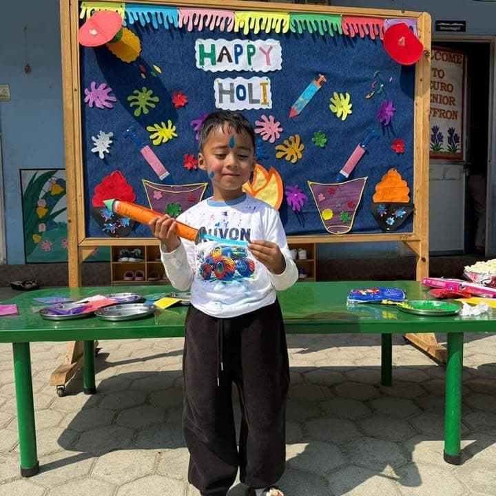 Child wearing a personalized Holi festival T-shirt from TOTOPASA